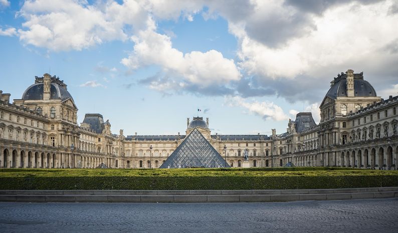 A wide shot of The Louvre Museum, Paris.